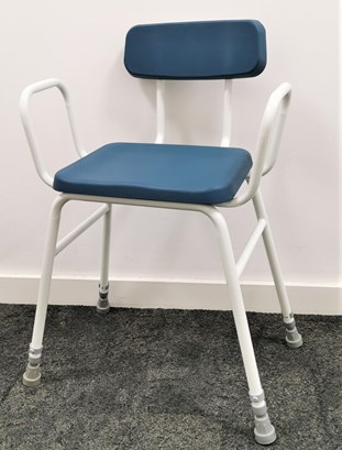 Blue plastic stool with arm and back rests